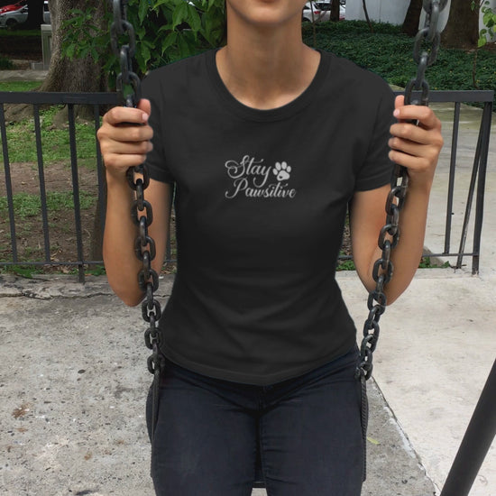Video showing the 'Stay Pawsitive' phrase on a black tee