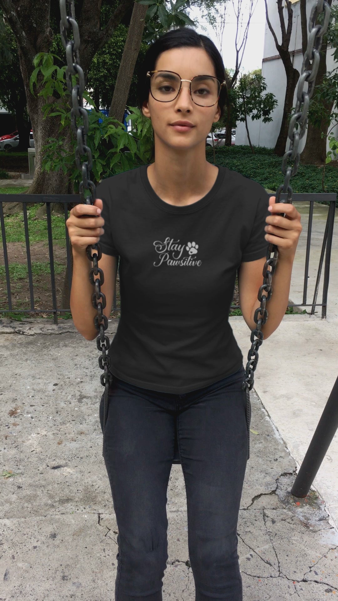 Video showing the 'Stay Pawsitive' phrase on a black tee